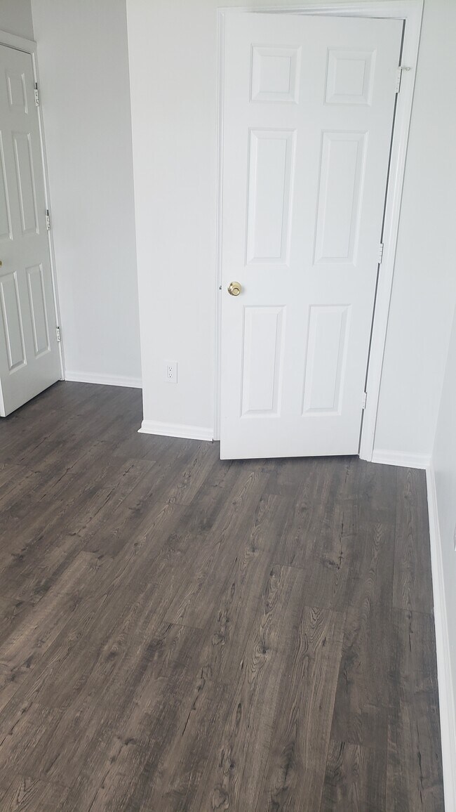 Bedroom #2 with new paint and flooring - 108 Prosperity Ave SE