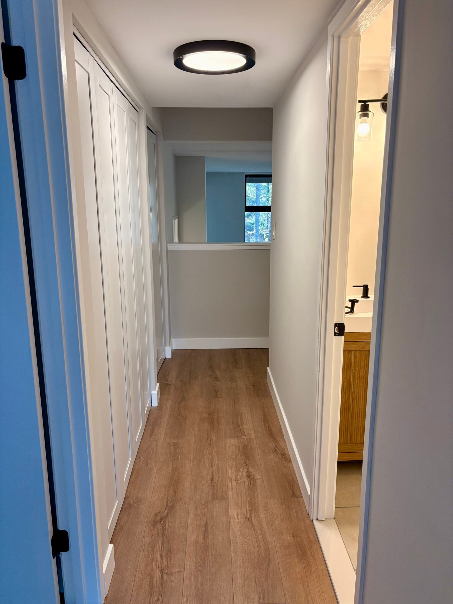 Hall way with access to washer and dryer - 11557 Rolling Green Ct