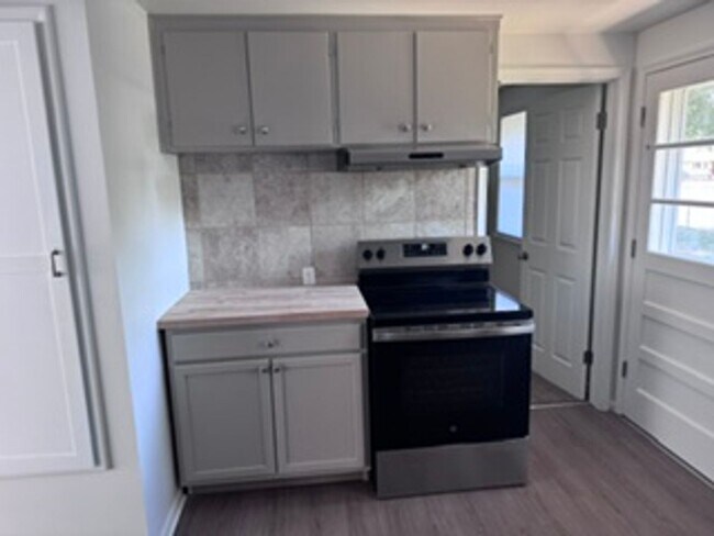 Building Photo - New Finishes in this Home on a Large Lot with Covered Parking and AIR CONDITIONING! MOVE IN READY!