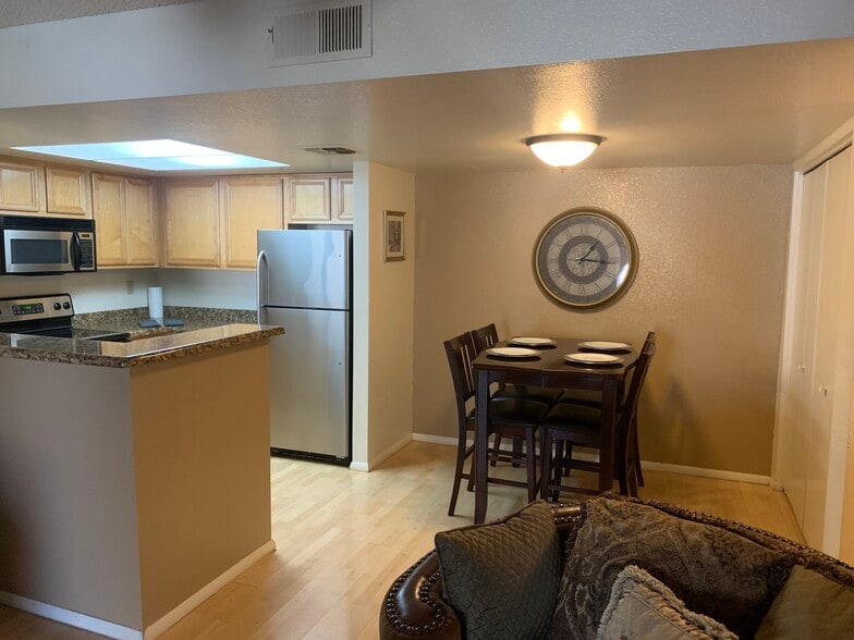 Furnished, ground floor, 2-bedroom condo with assigned covered parking.Pool,Spa,Tennis, Gym. - 5757 W Eugie Ave