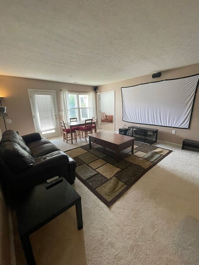 Building Photo - 2 Bed + Office Condo | Pool, Garage & Flexible Move-In