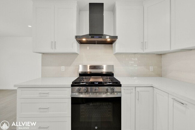Building Photo - Fully Renovated 4-Bedroom Home with Firepl...