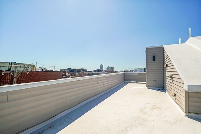 Building Photo - Stunning 4-Bedroom Townhouse with Garage and Rooftop Deck! Available late May!