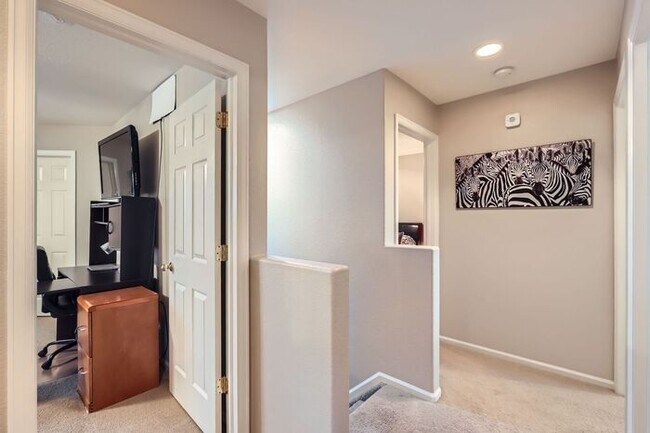 Building Photo - Updated 4-Bedroom with Serene Outdoor Spac...