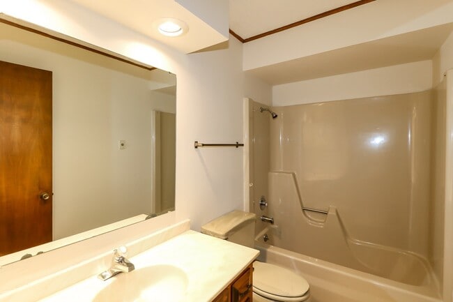 Building Photo - Two Bedroom, 2 Bath, 1-Car Garage, 1179 sq ft feet home with wood burning fireplace. and screened...
