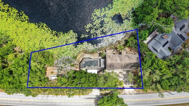 Building Photo - Available Now! Waterfront Living at Its Best – Pool, Decks & Gated Privacy