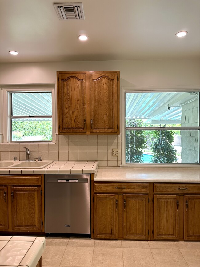 Kitchen view of garden and pool. - 5182 Woodley Ave