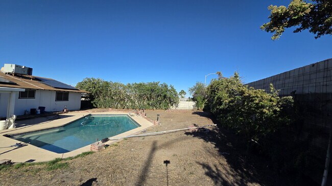 Building Photo - Beautifully remodeled pool home situated on a spacious quarter-acre lot