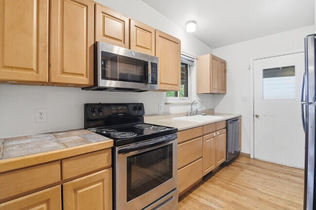 Building Photo - $2,495.95, 4 bed, 1.5 bath with a large backyard.