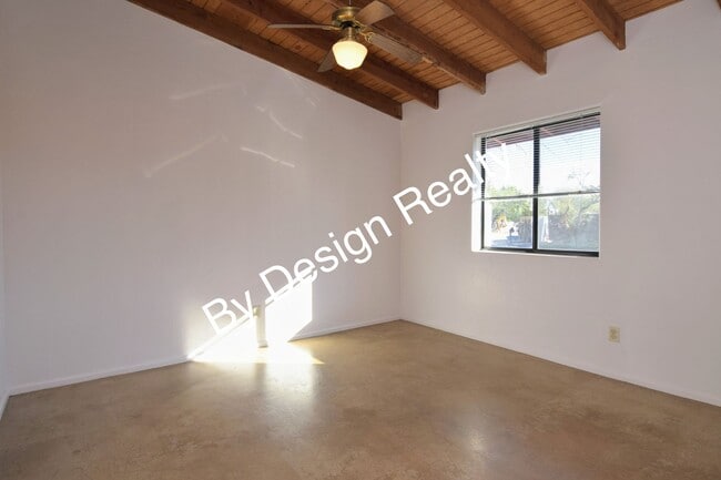 Building Photo - Charming Mid-Century Style: Vaulted Beams & Private Oversized Yard