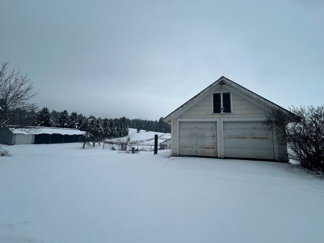 Building Photo - Bigfork Rodeo Farmhouse~ Fenced garden, greenhouse, garage, barn and shop!