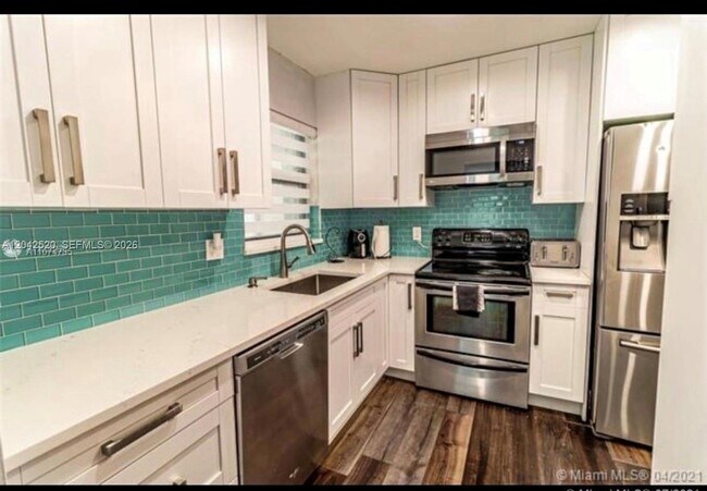 Building Photo - 3833 Cocoplum Cir