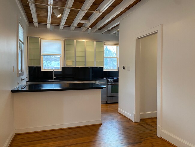 Kitchen with beams and overlooking yard - 4809 Calvert Rd