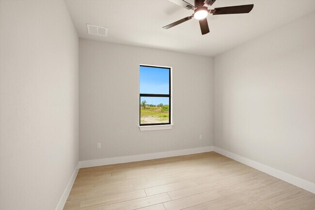Building Photo - New Construction 3/2 Pool Home on Canal, $2,699, NW Cape Coral. The Only Thing Used Here Is the W...