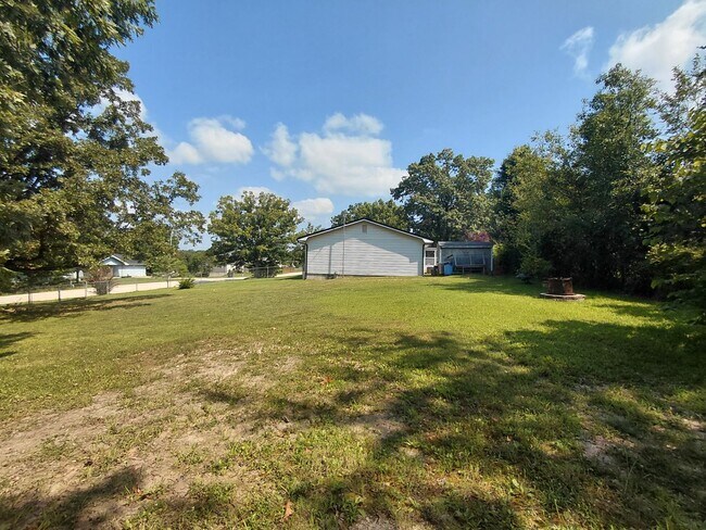 Building Photo - Fenced home close to post!