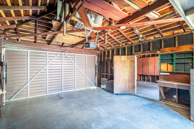 Both garages have electric doors and plenty off added shelving space for extensive storage. - 2935 Westwood Blvd