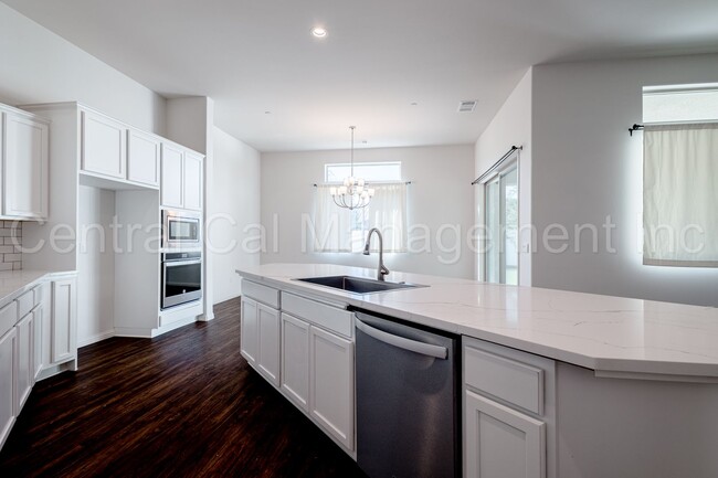 Building Photo - 4 Bedroom/3 Bath Home with Office and Paid Solar - $3295 Per Month!