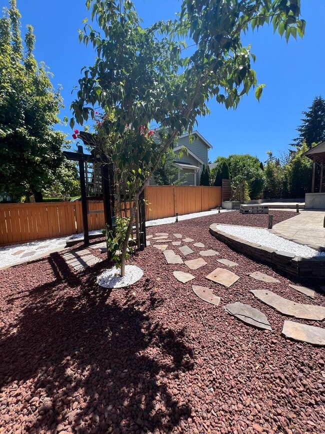 Building Photo - Spacious 4 Bedroom Home with Zen Backyard and 3-Car Garage