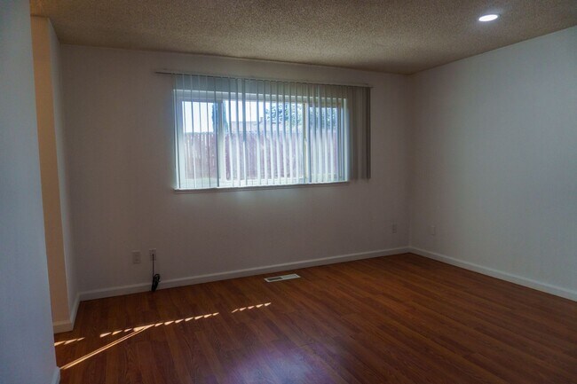 Building Photo - Spacious Three Bedroom, Two Bathroom House featuring Two Car Garage With Huge Yard