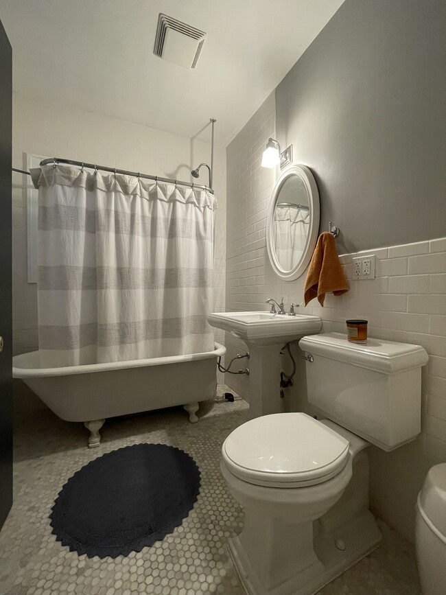 Full bathroom completely remodeled with original vintage tub. - 1023 28th Ave NE