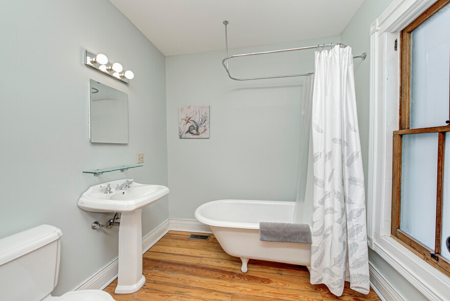 Full bath #2 with historic claw tub and shower - 237 E Saint Joseph St