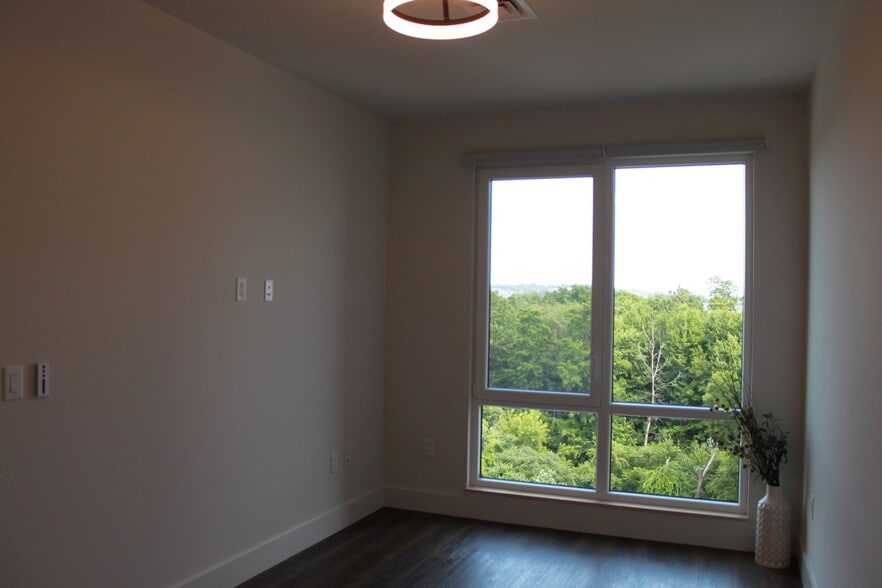 Motorized blinds give way to foliage views in the Bedroom - 125 Cambrian Way