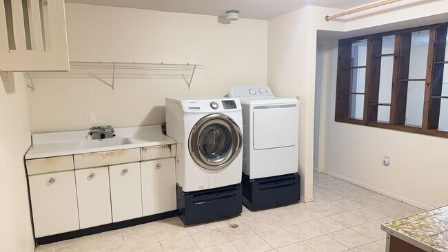 Building Photo - Spacious, four-bedroom, two-bathroom, coun...