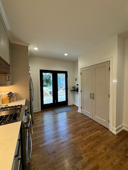 Grey doors open up to large food pantry and microwave - 507 Pace St