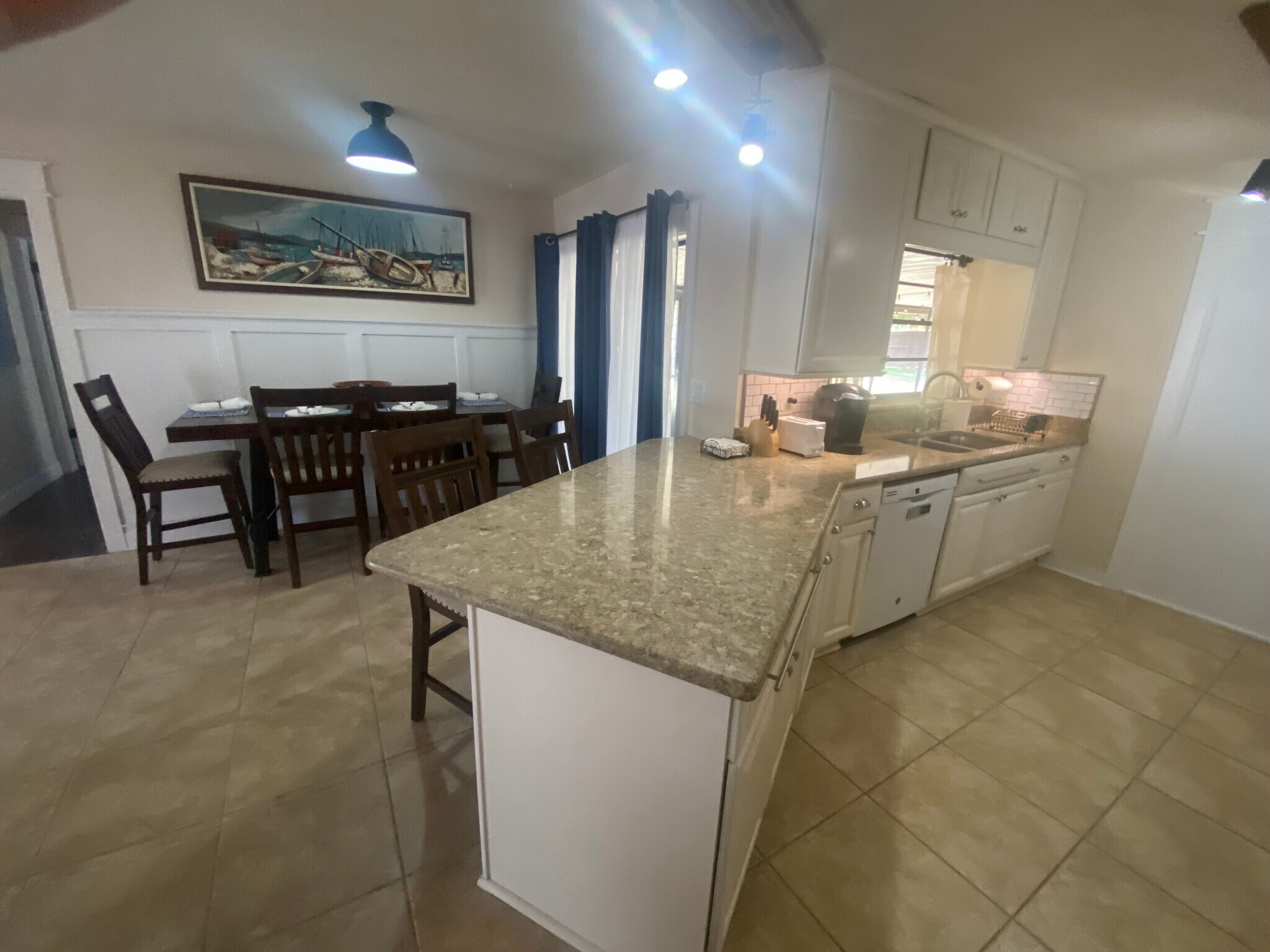 Dining area, breakfast bar and part of kitchen. - 648 Glenview Dr