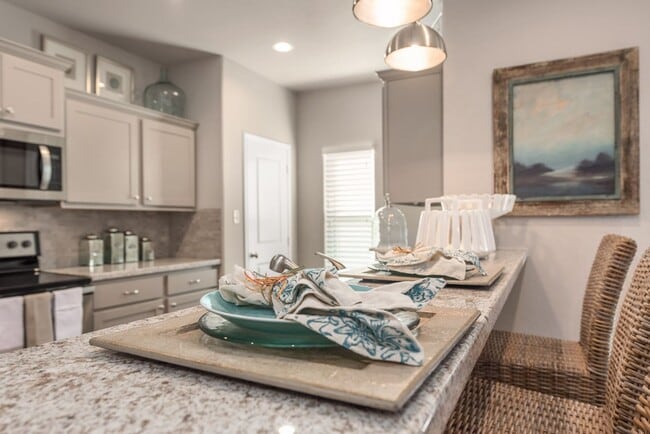 Building Photo - Now Pre-Leasing for August 2026! Well Appointed Townhomes with Fenced Backyards Close to Bus Stop...