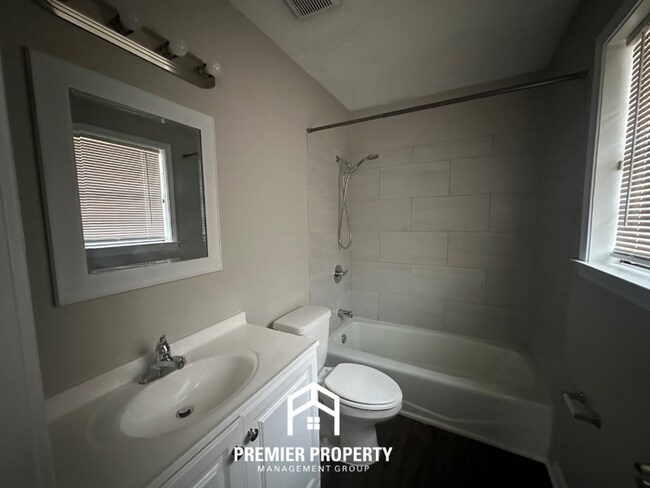 Building Photo - Charming 3BR Memphis Home | Rustic Brick Fireplace, Formal Dining & Fenced Backyard