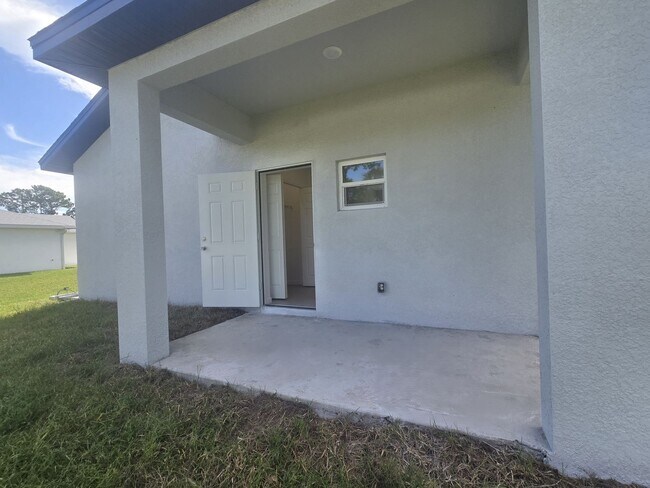 Building Photo - BRAND NEW-- TWO BEDROOM + TWO BATHROOMS- SOUTH LEHIGH ACRES