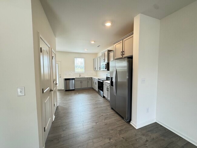 Building Photo - Corner townhome with three bedrooms 2 1/2 ...
