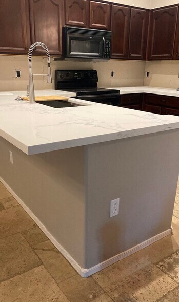 Kitchen upgraded, has backsplash, this was just an in progress photo when counter top was being done - 18250 N 32nd St
