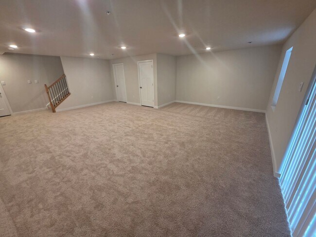 Building Photo - Luxury 4-Bedroom Townhome with Finished Walkout Basement & River Views