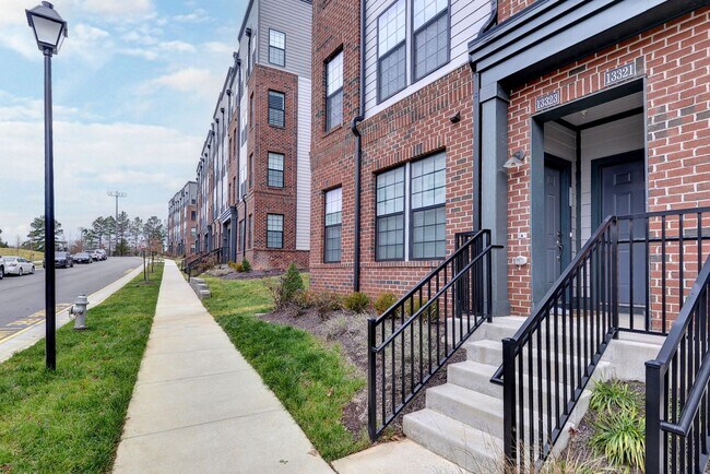 Building Photo - Three Story Brick End Unit with Rooftop Terrace