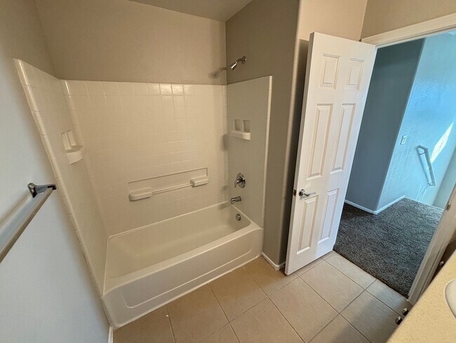 Building Photo - Spacious Tri-Level 4-Bedroom Home with Bal...