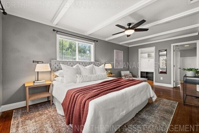 Building Photo - Welcome to this stunning 4-bedroom, 2-bath...