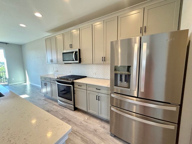 Building Photo - Impressive 4 Bedroom Townhome Nestled in M...