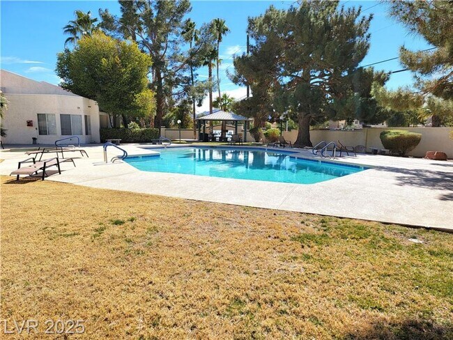Building Photo - Inviting Green Valley Condo with Dual Balc...