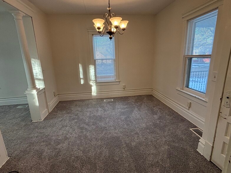 Large space off of kitchen to use as large dining or living room (main level space #1) - 203 E McKinley St