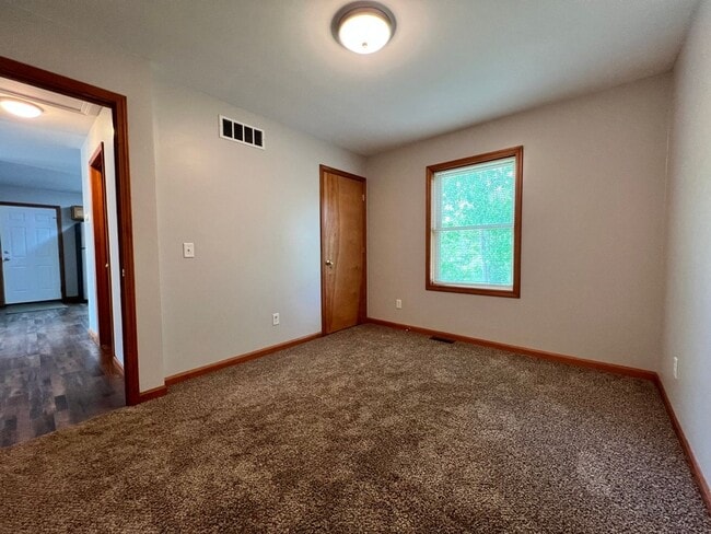 Building Photo - Spacious 3BR Duplex with Finished Basement & 2-Car Garage in Otsego