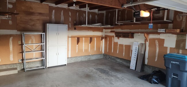 Building Photo - This is a spacious house featuring four bedrooms and two bathrooms, along with a two-car garage.