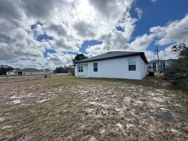 Building Photo - Spacious 4-Bedroom Home in Poinciana – Internet Included & No HOA Approval Required