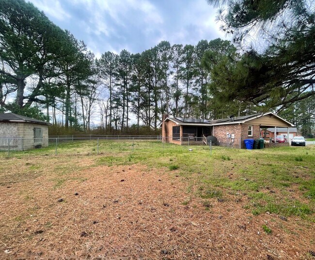 Building Photo - Spacious Home with Large Yard, Hot Tub, and More