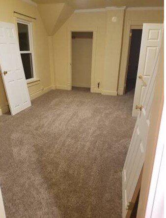 Upstairs middle room (2nd living room, or bedroom, doors installed now) This room has also been converted to new luxury vinyl planking. - 1527 South 10th Street
