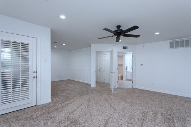 Building Photo - Gorgeous Mediterranean-style condo located...