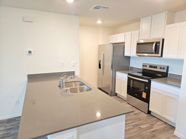 Building Photo - Kalea Trails Gated Cosmos Garden