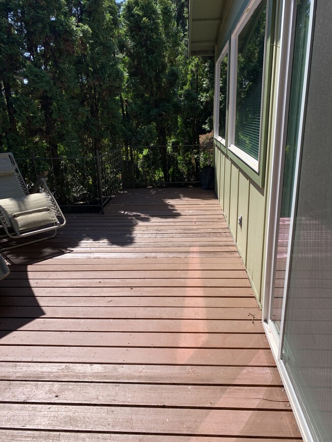 Deck with entrance to the kitchen - 15501 Spanaway Loop Rd S