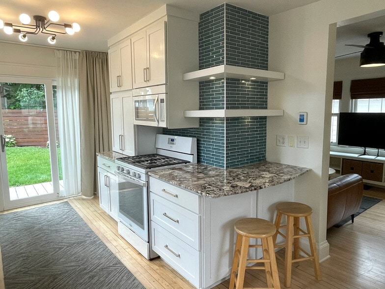 Appliance garage, display shelves, custom tile and lighting. - 3209 Atwood Ave